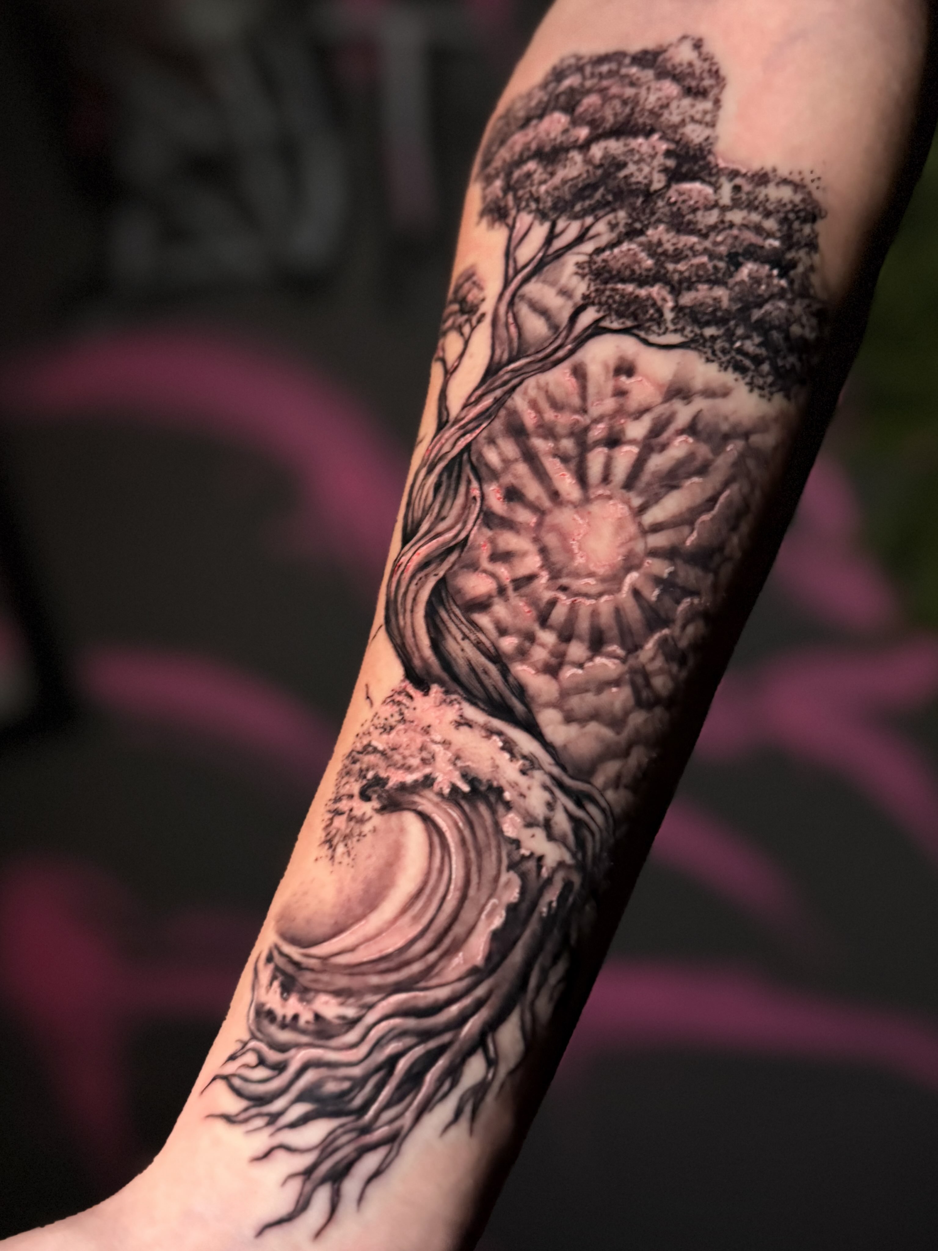 Fine-line tree and wave tattoo