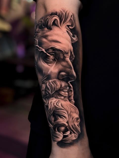 Realistic Zeus bust tattoo